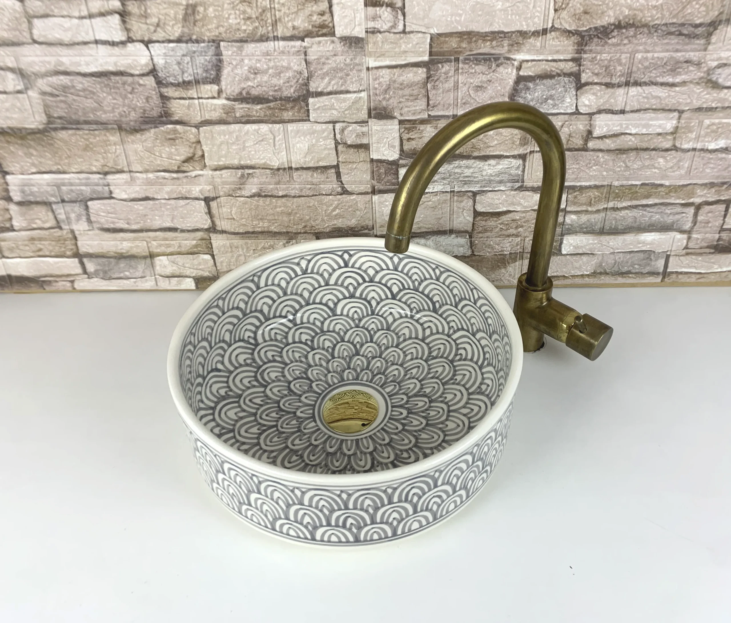 Artisan ceramic vessel sink from Morocco in grey tones