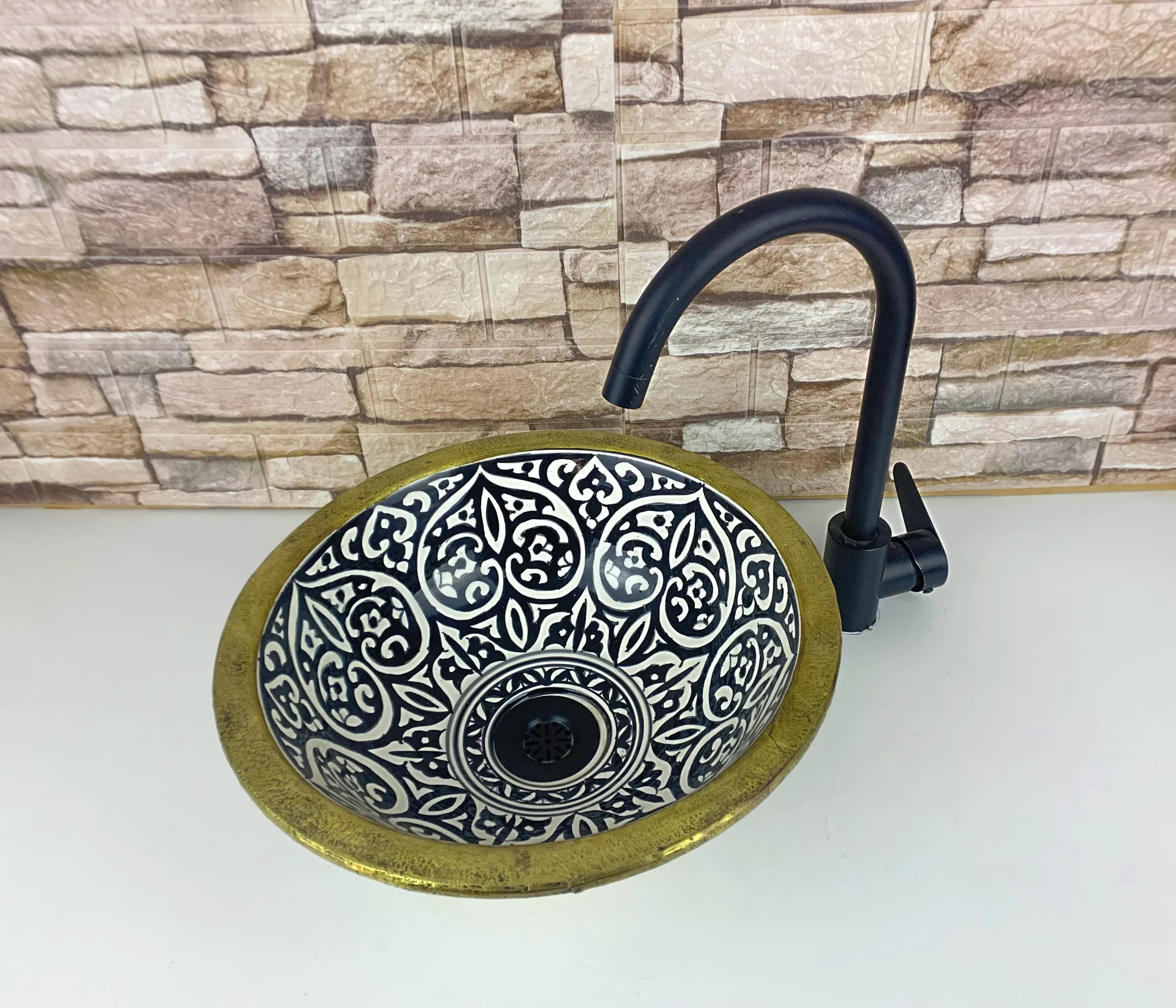 Artisan Moroccan countertop sink with geometric zellige pattern