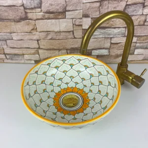 Artisan ceramic basin with geometric Moroccan design and glazed finish