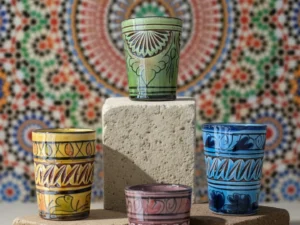 Handmade Safi pottery cups with colorful glaze and carved detailing