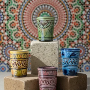 Handmade Safi pottery cups with colorful glaze and carved detailing