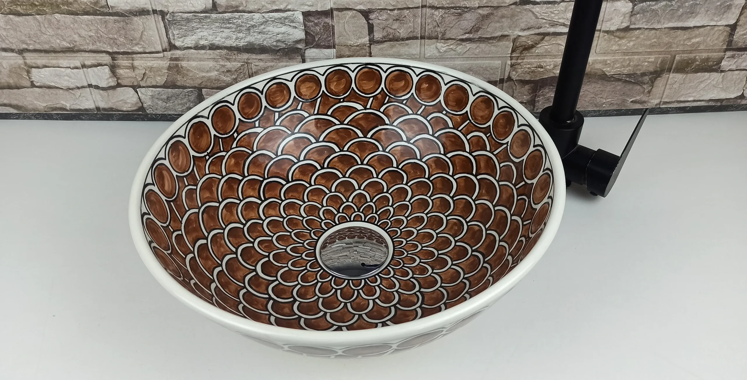Moroccan brown ceramic vessel sink with scallop pattern