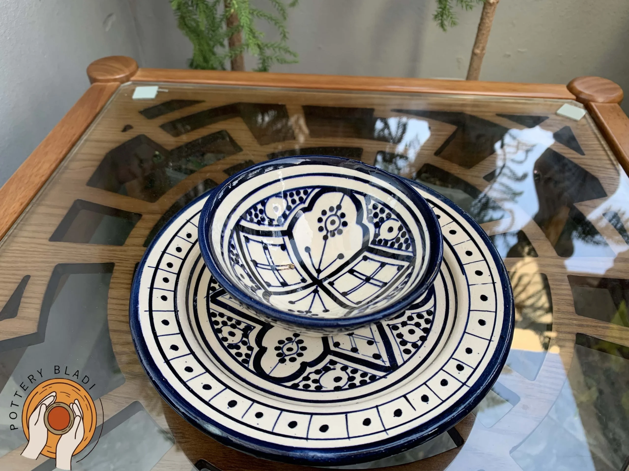 Moroccan ceramic bowl placed on matching serving plate